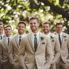 a group of men in suits standing next to each other