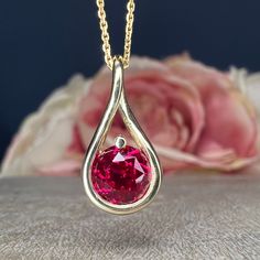 "This is a Ruby pendant necklace in 14k white/yellow gold. The round infinity charm necklace makes a great layering teardrop pendant necklace, the dainty ruby necklace, Maes a great birthday or Christmas present. The pendant pictured is a round lab created ruby #7798 for more ruby necklace pendants click here: https://etsy.me/3PJ3i7I for ruby rings click here: https://etsy.me/3Ak2j8e for ruby earrings click here: https://etsy.me/3AI79ht -Approximate total carat weight: approx. 1.00ctw diamond eq Ruby Pendant Necklace, Ruby Necklace Pendant, Ruby Rings, Infinity Charm, Christmas Necklace, Necklace Layering, Ruby Pendant, Necklace Pendants, Ruby Necklace