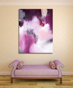 a painting hanging on the wall next to a purple bench in a room with hardwood floors