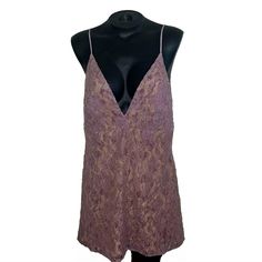 Embrace Dangerous Love With This Stunning Free People Lace Women's Mini Dress In Purple Wisteria. The Dress Features A V-Neckline, Strappy Sleeves, And A Zip Closure For Easy Wear. The Sleeveless Design And Short Dress Length Make It Perfect For Travel, Weddings, Or Parties. Crafted From A Blend Of Polyester, Nylon, Viscose, And Cotton, This Dress Is Both Comfortable And Stylish. The Lace Fabric Type Adds A Touch Of Elegance, While The Love Theme Is Perfect For Those Who Want To Make A Statement Lavender V-neck Dress For Date Night, Lavender V-neck Mini Dress For Party, Mauve V-neck Mini Dress For Summer, Sleeveless Mauve Mini Dress For Date Night, Mauve Sleeveless Mini Dress For Date Night, Purple Lace Mini Dress For Spring, Mauve V-neck Dress For Date Night, Flirty Lavender Sleeveless Mini Dress, Sleeveless Mauve Dress For Night Out