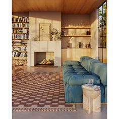 a living room filled with furniture and a fire place next to a book shelf full of books