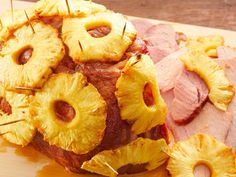 ham and pineapple slices on a cutting board