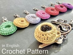 crochet keychains are lined up on a table with the words in english crochet pattern