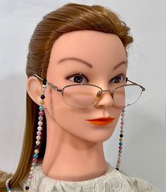 This is a handmade pearl eyeglass chain designed by our Angelic Beader, Miss Sonja.  She used a variety of bright colored 6 mm pearls, which inspired her to name it "The Jelly Bean Eyeglass Chain".  Sonja used Soft Flex beading wire for  extra strength and durability.  The chain is 29" long.  We will send it to you in a gift box with free domestic shipping.  Money from the sale of items in our shop goes to support the ministries and programs of Rocky Cross Baptist Church.  www.rockycross.org Excellent way to keep up with your reading glasses and sunglasses! Hint: Great Mother's Day gift! Multicolor Adjustable Glasses Chains For Gift, Elegant Multicolor Adjustable Glasses Chain, Elegant Adjustable Multicolor Glasses Chains, Beaded Glasses Chains Gift, Beaded Glasses Chains For Gift, Women's Glasses, Sunglasses Holder, Jelly Bean, Sunglass Holder