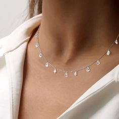 Adorn your neckline with elegance in our Cubic Zirconia Necklace in Sterling Silver. Embellished with several CZ stones, this necklace exudes stunning brilliance. Perfect for showcasing your chic clavicle, it adds a touch of glamour to any ensemble. Bridal Drop Necklace With Cubic Zirconia, Clavicle Chain Necklace For Party With Drop Shape, Bridal Cubic Zirconia Drop Necklace, Party Clavicle Chain Drop Necklace, Party Drop Clavicle Chain Necklace, Cubic Zirconia Drop Bridal Necklace, Dainty Drop Necklace With Cubic Zirconia, Party Clavicle Chain Necklace With Teardrop Pendant, Delicate Cubic Zirconia Clavicle Necklace