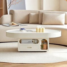 a living room with a white couch and coffee table