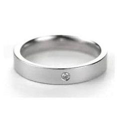 a white gold wedding band with a diamond