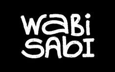 the words wabi sabi written in white on a black background