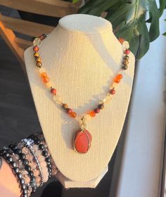 This piece is a gorgeous mix of red jasper, carnelian, citrine, and tigers eye. It is super warming and fun, flashing in the sunlight! Made with genuine gemstones and a hand wire wrapped red jasper pendant, this necklace is full of healing energy.  Made with stainless steel findings and hardware as well as tarnish resistant wire. Secured with a lobster clasp, this piece is 18 inches and adjustable to 22 inches in length. The pendant is 2x1 inches.  *handmade *one of a kind  *ships 3-5 days Spiritual Amber Beaded Necklaces With Natural Stones, Spiritual Amber Beaded Necklace With Natural Stones, Amber Citrine Beaded Necklace, Red Jasper Spiritual Necklace, Amber Crystal Necklace With Natural Stones For Healing, Orange Bohemian Crystal Necklace With Natural Stones, Bohemian Orange Crystal Necklace With Natural Stones, Adjustable Orange Crystal Necklace With Natural Stones, Red Agate Crystal Necklace For Healing