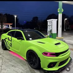 a neon green car parked in front of a gas station