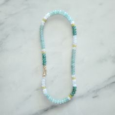 "This collection was originally inspired by nature - Variations of greens and yellows with a hint of complimentary colors. Along with color jade stones, there are some Aventurine which is a quartz. The Aventurine is a stone of prosperity and promotes compassion and empathy and feelings of well-being. The Green Aventurine hits the Heart Chakra which is about unconditional love, connection, acceptance, transformation and powerful healing. It is the centre of compassion, love, group consciousness and spirituality associated with a \"oneness\" with \"all that is\". Finished with 14k gold plated findings and a large ornate hook clasp. 18 inch in length 8 mm colored jade stones Mix of smooth rounds and faceted beads 14K plated, brass based findings, nickel and lead free Do not let sit in sunligh Green Minimalist Jewelry With Faceted Beads, Minimalist Green Jewelry With Faceted Beads, Handmade Minimalist Green Beaded Necklace, Green Handmade Minimalist Beaded Necklace, Minimalist Handmade Green Beaded Necklace, Everyday Green Spiritual Necklace, Green Amazonite Round Beads Necklaces, Green Amazonite Beaded Necklaces, Handmade Green Amazonite Crystal Necklaces