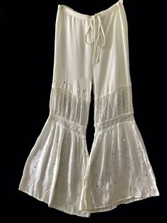 Raga Flared Ivory Sequin Embroidered Drawstring Pants M / L New. Garment tag says large but I have listed it as M/L to adjust for measurements. Waist measurements on a flat surface from side to side 16 to 18 with stretch, length from top to bottom 42 inches, Inseam 30 inches, rise 13 inches. Drawstring Pants, Women Accessories, Pants, Clothes For Women, Clothes