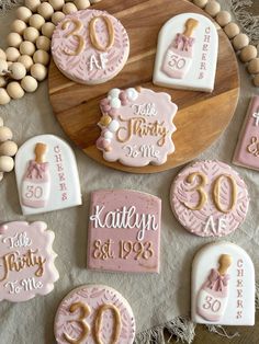 decorated cookies are arranged on a table