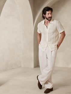 a man in white pants and a shirt