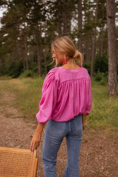 The lightweight Pink Eddie Shirt features pleated fabric on the front and 7/8th balloon sleeves, made from incredibly soft material for a flowy fit. The shirt also includes a button placket for easy closure. This shirt also comes in Beige Our model is also wearing the Blue Maddie Jeans One size (fits from US sizes 2-8) Length 26.4 in - Width 35.4 in 100% Cotton Washing: handwash Casual Tops With Bishop Blouson Sleeves, Spring Bishop Sleeve Blouse In Relaxed Fit, Casual Peasant Top With Lantern Sleeves For Daywear, Spring Bishop Sleeve Blouse With Relaxed Fit, Spring Bishop Sleeve Tops For Daywear, Spring Button-up Tops With Gathered Sleeves, Casual Long Sleeve Tops With Pleated Sleeves, Casual Tops With Pleated Sleeves For Spring, Casual Tops With Pleated Billowy Sleeves