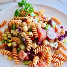 a white plate topped with pasta salad