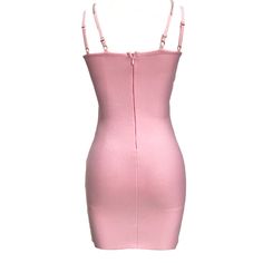 Introducing our stylish Pink Cocktail Dress, designed to make you stand out at any party or event. Made from high-quality satin fabric, this dress is not only comfortable but also durable. Its sleeveless design and mini length add a touch of allure to your look, while the natural waistline creates a flattering silhouette. The dress features a trendy strap neckline, adding a hint of sophistication. Its bodycon silhouette enhances your curves, making you feel confident and elegant. Crafted from breathable and sustainable polyester material, this dress is not only fashion-forward but also eco-friendly. The solid pink color adds a playful and feminine touch, perfect for the summer season. It comes in sizes XS-L to ensure a comfortable fit for every body type. Whether you're attending a club ni Bodycon Sleeveless Corset Dress For Party, Sleeveless Bodycon Corset Dress For Party, Fitted Mini Suspender Dress For Evening, Mini Length Party Slip Dress, Fitted Mini Club Dresses, Fitted Pink Sleeveless Dress For Evening, Chic Mini Club Dresses, Chic Spaghetti Strap Corset Dress For Club, Spring Mini Length Suspender Dress For Night Out