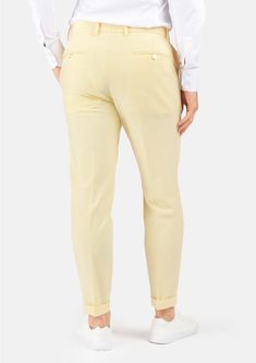 Crafted with a vibrant, cream yellow stretch cotton, these custom made pants are uniquely stylish and supremely comfortable, and will become a go to favorite when you're looking to stand out. Fitted High-waisted Summer Chinos, Chic Yellow Cotton Pants, Fitted Cream Cotton Pants, Chic Fitted Cotton Chinos, Mustard Fitted Bottoms For Workwear, Fitted Mustard Bottoms For Workwear, Stretch Yellow Cotton Bottoms, Yellow Cotton Stretch Bottoms, Yellow Stretch Cotton Bottoms