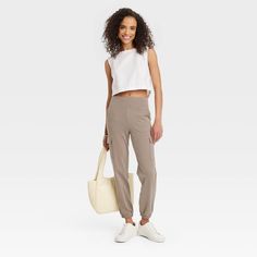 Bring comfort and style to your casualwear wardrobe with these Relaxed-Fit Super-Soft Cargo Joggers from A New Day™. Tailored in a slim-fit silhouette, these mid-rise cargo jogger pants are crafted from a soft, midweight fabric with spandex for all-day stretchy comfort. Featuring a wide waistband that stays comfortable on your waist, these relaxed-fit joggers feature two side stash pockets and two side cargo pockets that you can use to hold small essentials. Designed in a solid hue, they're easy Casual Mid-rise Sweatpants For Workout, Casual Stretch Mid-rise Joggers, Fitted Casual Sweatpants For Everyday, Casual Fitted Sweatpants, Fitted Casual Sweatpants, Casual Stretch Activewear For Day Out, Fitted Mid-rise Casual Joggers, Black Jogger Pants, Leather Joggers