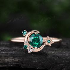 This is a round 5mm Lab emerald engagement ring in solid gold, The accent stones are lab emeralds and diamonds or moissanites. The band width is about 1.4mm. It can be made in any ring size. However please contact me to custom make it to a special big or small size. It can be made in white gold,rose gold or yellow gold Round Emerald Engagement Ring, Star Diamond Ring, Green Emerald Engagement Ring, Indian Wedding Rings, Diamond Ring Women, Emerald Engagement Rings, Emerald Engagement Ring Green, Wedding Ring Sets Unique, Smaragd Ring