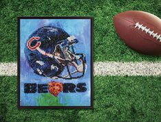 a painting of a football and helmet on a field with the words detroit lions painted on it