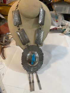 This by far is quite an impressive piece . It demands immediate response when seen . Bought this years ago from. Native American silversmith . All hand made . Has patina . Did not clean yet . This is the last of my signed jewelry . Thinning out my collection . Quite the show stopper . Only wore a few times. Ref pics sold as is . Sterling , signed , gorgeous turquoise. Antique Silver Vintage Jewelry With Large Pendant, Vintage Antique Silver Jewelry With Large Pendant, Vintage Sterling Silver Turquoise Necklace With Patina, Southwestern Style Engraved Turquoise Necklaces, Vintage Silver Turquoise Necklace With Patina, Vintage Turquoise Engraved Jewelry, Silver Artisan Necklace With Patina, Artisan Silver Necklace With Patina, Artisan Necklace With Patina For Collectors