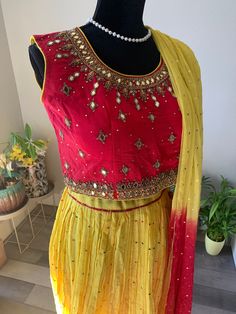 Beautiful crushed silk lehenga set with grand, mirror work blouse and foil print georgette dupatta. The lehenga has polka dots work and is lemon yellow shade. The lehenga top has heavy zardosi work as well as mirror work. Dupatta has gold foil print and comes with latkans at the ends.  Sleeves can be attached on request for a minimal price. Size of blouse : Bust size 38-39 inches (Size M) Size M - Crushed Silk Lehenga Set with Mirror Work Blouse | mirror work lehengas online shopping usa | cropp Blouse Mirror Work, Grand Mirror, Top Lehenga, Lehenga Top, Crop Top Lehenga, Mirror Work Blouse, Zardosi Work, Georgette Dupatta, Gold Foil Print