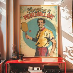 there is a poster with a man holding a tennis racket in his hand on the wall