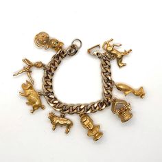 Throwback Vintage Charm Bracelet. Unsigned. There Is Color Loss On The Gold Metal But Still Very Wearable. The Charms Are Heavy And Solid. Charms Include: Jfk Pig Horse Wishing Well Cow Adorable Cat With Green Rhinestone Eyes Bird Ballerina 644 Rhinestone Eyes, Vintage Charm Bracelet, Wishing Well, Vintage Charms, Womens Jewelry Bracelets, Vintage Gold, Vintage Collection, Cute Cats, Gold Metal