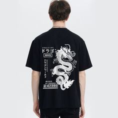 Introducing our Dragon T-Shirt, a symbol of strength and power. Crafted with high-quality materials, this shirt exudes luxury and sophistication. Its sleek design and intricate dragon motif will leave a lasting impression. Elevate your style with this exclusive piece and make a powerful statement wherever you go. Features: -100% Cotton -Crew Neckline -Dropped Shoulder -Regular fit -Unisex style Dragon Motif, Symbol Of Strength, New Dragon, Symbols Of Strength, Free Socks, Blue Khakis, Free Bracelet, A Symbol, Fashion App