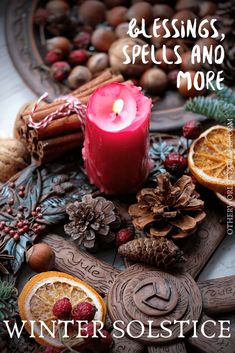 a candle and some fruit on a table with words that read blessing, spells and more