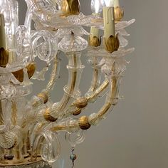 Beautiful Venetian 12-light arm chandelier. Elegant high quality master handcrafted Murano glass chandelier with 24-karat gold dust merged in clear Murano glass. Combined transparent Murano glass and 24-karat yellow gold dust. Typical Venetian baroque style chandelier Very good condition. Slight rust marks on small iron parts. This piece is designed in the style of the selected designer and/or manufacturer, Up to 250V (Europe/UK Standard).The wiring of this item may be original and might need re Murano Chandelier, Arm Chandelier, Hanging Lamps, Gold Dust, Murano Glass Chandelier, Chandelier Style, Baroque Style, Baroque Fashion, Glass Chandelier