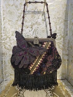 Vintage Chicos beaded evening bag Photos do not do this bag justice! Absolutely stunning beaded and sequin bag with beaded fringe, beaded and gemstone butterfiles, brass colored hardware. Cines with beaded strap and also a crossbody longer metal strap. One sequin ball missing that's not noticeable at all see photo. NOTE : Pre-Owned/Vintage items sometimes have some minor Scuff Marks, Scratches, spots, Paint Loss or Discoloration, that comes with the age of the item. Sometimes color may show up d Party Clutch With Beaded Fringe, Party Clutch Bag With Beaded Fringe, Beaded Fringe Clutch For Party, Party Clutch Bags With Beaded Fringe, Rectangular Evening Bag With Beaded Fringe, Evening Rectangular Bags With Beaded Fringe, Evening Rectangular Bag With Beaded Fringe, Formal Rectangular Bags With Beaded Fringe, Formal Rectangular Bag With Beaded Fringe