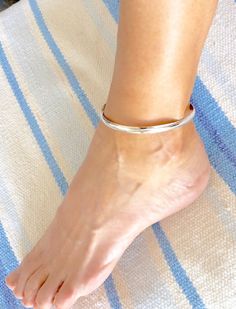 This solid Sterling silver anklet is approx 1/4 inches wide, handmade, beautiful affordable great year round jewelry and makes a great gift! This anklet also comes in 14/20 yellow Gold. This anklet has been hand crafted and polished for a gorgeous bright shiny beauty. This anklet can get wet, sandy, sweaty and it will be just fine, this anklet is easy to wear every day. This brilliant polished shiny Sterling silver anklet is sturdy yet flexible to gently adjust your individual fit which makes it Kada For Women, Leather Anklets, Anklet Silver, Silver Ankle Bracelet, Anklet Designs, Summer Anklets, Silver Anklet, Women Anklets, Sterling Silver Anklet