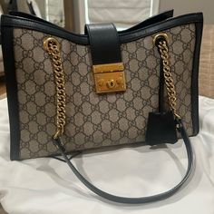 Gucci Gg Supreme Padlock Medium Shoulder Bag With Black Details. Includes Dust Bag. Used A Few Times. Very Good Condition, No Tears Or Imperfections. Very Few Tiny Marks On Gold Padlock. Leather And Canvas In Very Good Condition. Paid $2600 Product Details Style 479197 Khnkg 9769 A Shoulder Bag With A Strap That Secures With A Key Lock Closure Pulled Straight From The Archives. The Structured Shape Is Crafted From Beige And Ebony Gg Supreme Canvas And Completed With Black Leather Details. First Gucci Ophidia Bag, Gucci Gg Marmont Matelasse, Gucci Crossbody Bag, Gucci Purse, Patent Leather Bag, Gucci Crossbody, Leather And Canvas, Gucci Shoulder Bag, Key Lock