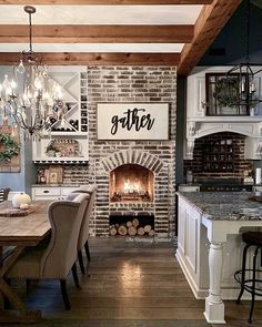 a dining room table with chairs and a fire place in the middle of the room