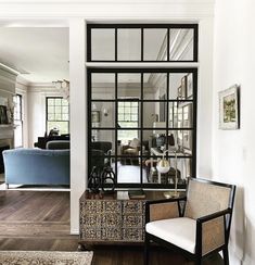 a living room filled with furniture and windows