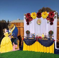 the beauty and the beast birthday party is set up outside