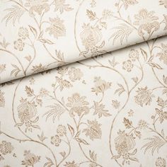 a close up shot of a wallpaper with flowers and leaves in gold on white