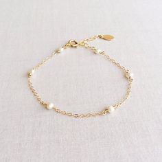 Dainty Pearl Bracelet Pearl Bracelet Gold Pearl Bracelet | Etsy Dainty Pearl Charm Bracelet Adjustable, Elegant Pearl Charm Bracelet For Wedding, Elegant Pearl Bracelet With Extender For Gift, Elegant Pearl Bracelet With Extender As Gift, Delicate Pearl Gold Bracelet For Gift, Dainty Hypoallergenic Charm Bracelet For Weddings, Dainty Pearl Bracelets For Anniversary, Wedding Gold Bracelet With Pearl Drop, Wedding Gold Pearl Bracelet With Pearl Drop