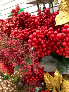 red berries and gold leaves are on display