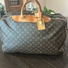 Louis Vuitton Alize Two Pocket Travel Bag Keep All Bandolier 50 Brown Monogram With Complete Lv Luggage Tag . It’s Already Been To Poshmark Once! Bag Is In Excellent Pre Loved Condition! This Travel Bad Is Perfect For Both Men And Women! With(Inches). 21.6 Inches (Approx) With (Cm). ,5cm (Approx) Height (Cm). 42 Cm (Approx) Height (Inches). 16.5 Inches (Approx) Depth(Inches). 5.1 Inches (Approx) Depth (Cm). 13.Cm (Approx) Designer Brown Travel Bag For Trips, Luxury Coated Canvas Bags For Trips, Designer Brown Bag For Trips, Designer Brown Travel Bag, Designer Monogram Canvas Luggage For Everyday Use, Designer Brown Travel Bag For Business Trips, Designer Monogram Canvas Travel Bag With Luggage Sleeve, Brown Monogram Canvas Bags For Business Trips, Luxury Brown Luggage With Dust Bag Included