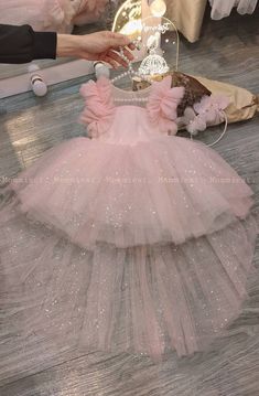 ** Please let a note about your current baby girl age/weight/height in checkout/inbox to help us prepare your order better ! Unique and beautiful high low light pink sparkly tulle baby girl dress made by Mommiest. They are perfect for any special occasions such as wedding, birthday, first birthday, party, photoshoots,... Material: tulle, satin, chiffon Washing care: Handwash at 20 oC max; Wool spin mode; Iron at 100oC max *This design dress will be handmade to order within 10 days, so let us kno First Birthday Girl Dress, Baby Princess Party, 1st Birthday Girl Dress, 1st Birthday Dress, Quinceanera Pink, Birthday Baby Girl, Pink Baby Dress, 1st Birthday Dresses, First Birthday Dresses