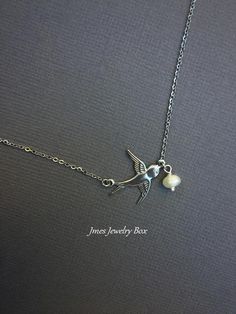 Dainty little silver bird necklace with dangling cream freshwater pearl. Sweet little stainless steel sparrow is connected along the chain with sturdy stainless steel links. This necklace is 18'' long with wire wrapped lobster clasp. *Stainless steel sparrow *Stainless steel chain *4-5 mm freshwater pearl *Handmade with love <3 Like Jmesjewelrybox on Facebook for updates on new jewelry, upcoming sales and giveaways! Plus Facebook fans save 5% :D Find the coupon code on Jmesjewelrybox's cover Silver Bird Necklace, Dove Necklace, Dragonfly Bracelet, Dragonfly Jewelry, Silver Bird, Flying Bird, Bird Necklace, Dream Style, Bird Jewelry