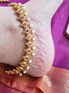 Ethnic bridal high quality antique gold plated payal anklet pair with soft bells at the end. Studded with semiprecious stones. Stones and gold polish is guaranteed. All pearls are hand settled carefully. Total length - 12 inches. Design height - 1 1/2 cm Jewelry care instructions : 1. Keep jewelry away from direct heat,water,perfumes,deodorants and other strong chemicals. 2. Any moisture or sweat should be properly wiped off before preserving inside.Store it in air tight zip lock bags NOT in vel Traditional Ceremonial Festival Anklets, Temple Jewelry Tilla Anklets For Puja, Toe Ring Anklets With Latkans For Wedding, Traditional Anklets With Latkans For Gift, Traditional Tilla Anklets For Weddings, Festive Meenakari Anklets For Wedding, Wedding Toe Ring Anklets With Latkans, Festive Toe Ring Anklets For Rituals, Traditional Wedding Anklets For Festivals