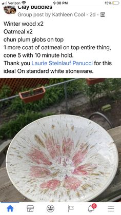 a white plate sitting on top of a wooden table next to a red and white sign