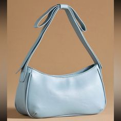 Mail And Lili Bow Shoulder Bag Light Blue Nwt 5x11.5”X3” Offers Welcome Trendy Light Blue Shoulder Bag For Shopping, Luxury Light Blue Everyday Shoulder Bag, Modern Light Blue Shoulder Bag, Light Blue Shoulder Bag With Zipper Closure, Chic Light Blue Shoulder Bag For On-the-go, Light Blue Purse, Anthropologie Bags, Clothes Wishlist, Blue Purse