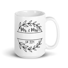 A commemorative gift to remember the big day in 2024. A personalized wedding mug with the new couples last name. Add these mugs to a gift basket with special coffees and treats or gift cards for the bride and groom. Whether you're drinking your morning coffee, evening tea, or something in between--this mug's for you! It's sturdy and glossy with a vivid print that'll withstand the microwave and dishwasher. * Ceramic * 11 oz mug dimensions: 3.8″ (9.6 cm) in height, 3.2″ (8.2 cm) in diameter * 15 o Wedding Coffee, Wedding Mug, Head Table Decor, Everyday Wreaths, A Gift Basket, Coffee Wedding, Dog Wreath, Wedding Mugs, Mr And Mrs Wedding