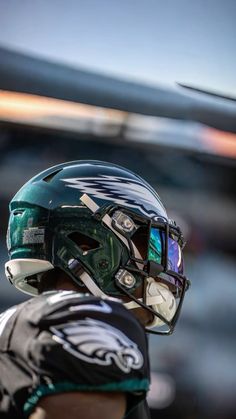 a close up of a football player wearing a helmet