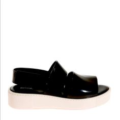 Pvc Sandals Color: Black And White Velcro Closure Rubber Sole Composition: Other Materials Exterior, Other Materials Interior, Other Materials Sole. Made In Brazil. Dimensions: Sole Height 3. 5 Cm. Black Jelly Sandals With Platform And Round Toe, Black Platform Jelly Sandals With Round Toe, Casual Patent Leather Sandals With Flat Heel, Casual Flat Heel Patent Leather Sandals, Modern Patent Leather Slip-on Sandals, Casual Patent Leather Closed Toe Sandals, Black Platform Jelly Sandals In Synthetic, Black Platform Jelly Sandals In Synthetic Material, Black Platform Jelly Sandals